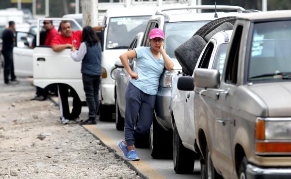 Motorists wait in line for hours to buy gasoline at a Pemex service station in Guadalajara, Mexico, on Sunday. The Mexican president temporarily closed some of the state oil company's pipelines, in a bid to wipe out rampant fuel theft. Motorists wait in line for hours to buy gasoline at a Pemex service station in Guadalajara, Mexico, on Sunday. The Mexican president temporarily closed some of the state oil company's pipelines, in a bid to wipe out rampant fuel theft.