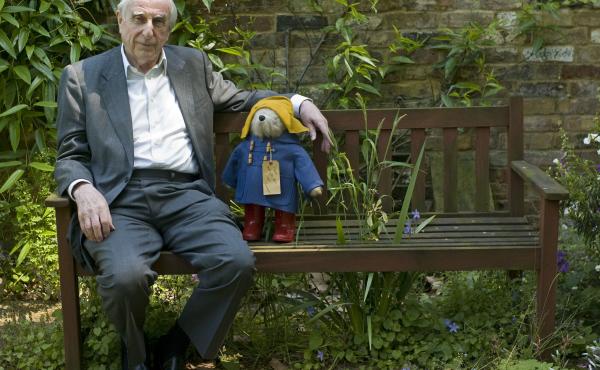 Michael Bond sits with a Paddington Bear toy in 2008. Bond died Tuesday, according to his publisher, nearly six decades after his beloved character first appeared in print. Michael Bond sits with a Paddington Bear toy in 2008. Bond died Tuesday, according to his publisher, nearly six decades after his beloved character first appeared in print.
