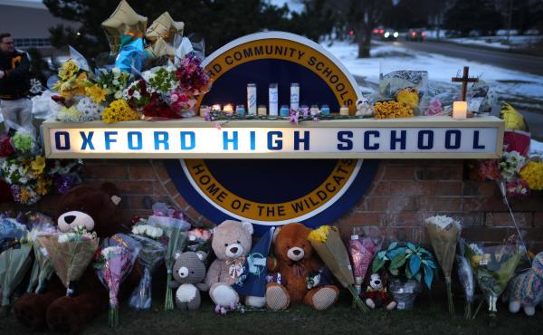A makeshift memorial seen outside Oxford High School in Oxford, Mich., on Wednesday honors the four students who were fatally shot and seven people who were injured. A makeshift memorial seen outside Oxford High School in Oxford, Mich., on Wednesday honors the four students who were fatally shot and seven people who were injured.