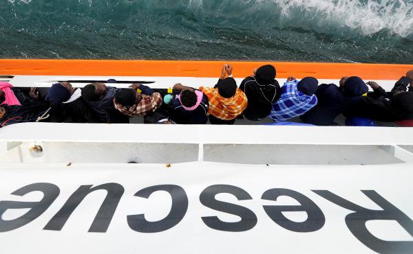 Migrants wait to disembark from the rescue ship Aquarius in the Sicilian harbor of Catania, Italy, on May 27. This past weekend the ship picked up more migrants, but was turned away from ports in Sicily and the nearby country of Malta. Now it will head fo Migrants wait to disembark from the rescue ship Aquarius in the Sicilian harbor of Catania, Italy, on May 27. This past weekend the ship picked up more migrants, but was turned away from ports in Sicily and the nearby country of Malta. Now it will head fo