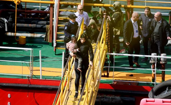 Migrants disembark from the motor tanker El Hiblu 1 in Valletta's Grand Harbour after Maltese armed forces took control of the vessel on Thursday. Migrants disembark from the motor tanker El Hiblu 1 in Valletta's Grand Harbour after Maltese armed forces took control of the vessel on Thursday.