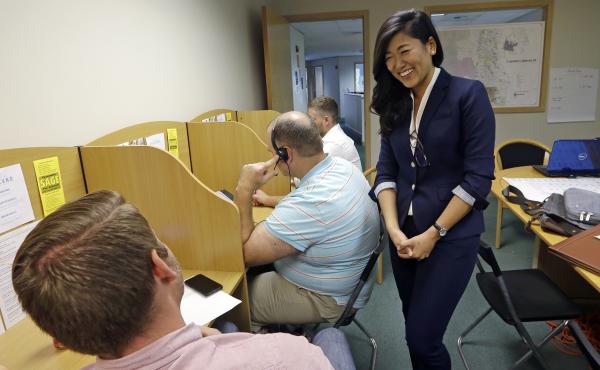 Jinyoung Lee Englund, the Republican candidate for 45th district Senate seat in Washington, talks with volunteers at her campaign headquarters in Woodinville, Wash. The race has attracted national attention and money because Englund's loss would give Demo Jinyoung Lee Englund, the Republican candidate for 45th district Senate seat in Washington, talks with volunteers at her campaign headquarters in Woodinville, Wash. The race has attracted national attention and money because Englund's loss would give Demo
