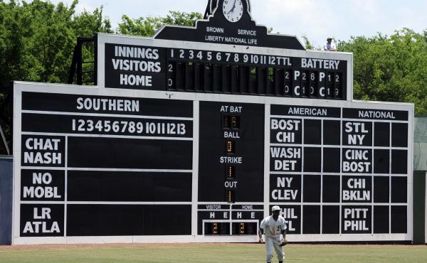 Birmingham Barons outfielder Luis Basabe moves toward a ball in front of the vintage scoreboard in 2019 at Rickwood Field, America's oldest baseball park, in Birmingham, Ala. Birmingham Barons outfielder Luis Basabe moves toward a ball in front of the vintage scoreboard in 2019 at Rickwood Field, America's oldest baseball park, in Birmingham, Ala.