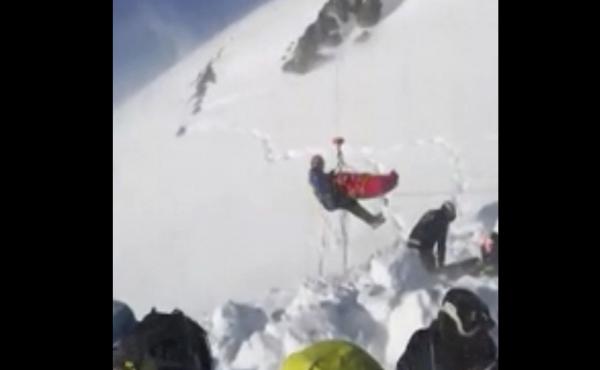 In this grab taken from validated UGC provided on Thursday, Dec. 27, a boy is airlifted after an avalanche, on the French Alps on Wednesday. Rescuers are calling a true "miracle." In this grab taken from validated UGC provided on Thursday, Dec. 27, a boy is airlifted after an avalanche, on the French Alps on Wednesday. Rescuers are calling a true "miracle."