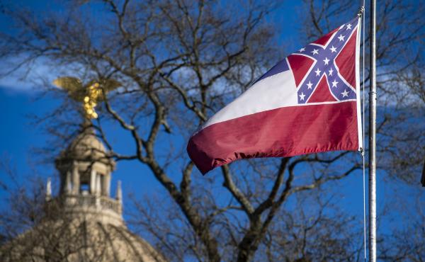 The flag of the state of Mississippi flies in front of the Mississippi State Capitol dome on Jan. 10, 2019. Lawmakers have cleared the way for legislation to remove and replace the flag. The flag of the state of Mississippi flies in front of the Mississippi State Capitol dome on Jan. 10, 2019. Lawmakers have cleared the way for legislation to remove and replace the flag.