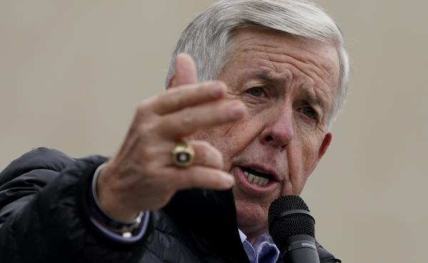 Missouri Gov. Mike Parson speaks at a campaign rally at a gun store in October in Lee's Summit, Mo. Parson has signed into law a measure that could fine state and local law enforcement officers $50,000 for helping to enforce federal gun laws. Missouri Gov. Mike Parson speaks at a campaign rally at a gun store in October in Lee's Summit, Mo. Parson has signed into law a measure that could fine state and local law enforcement officers $50,000 for helping to enforce federal gun laws.
