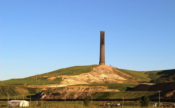 This smokestack, left over from a century of copper mining, spewed up to 24 tons of arsenic per day over an area the size of New York City. This smokestack, left over from a century of copper mining, spewed up to 24 tons of arsenic per day over an area the size of New York City.
