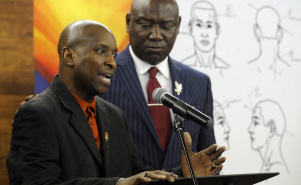 Flanked by attorney Ben Crump, Emantic Bradford Sr. discusses the results of a forensic examination on his son Emantic "EJ" Bradford Jr., who was fatally shot by police after a shooting in a shopping mall on Thanksgiving Day, after being mistaken for a su Flanked by attorney Ben Crump, Emantic Bradford Sr. discusses the results of a forensic examination on his son Emantic "EJ" Bradford Jr., who was fatally shot by police after a shooting in a shopping mall on Thanksgiving Day, after being mistaken for a su