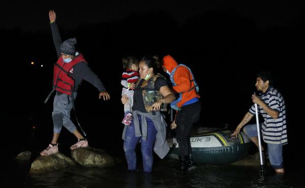 A group of migrants from El Salvador arrives in Roma, Texas, after crossing the Rio Grande on March 30, 2021 in Roma, Texas. A group of migrants from El Salvador arrives in Roma, Texas, after crossing the Rio Grande on March 30, 2021 in Roma, Texas.
