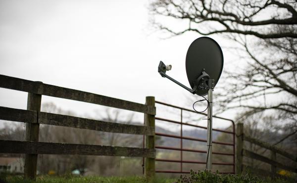 A Viasat internet satellite dish is seen in the yard of a house in Madison, Va., on March 31. A Viasat internet satellite dish is seen in the yard of a house in Madison, Va., on March 31.