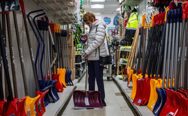 A woman inspects a snow shovel at Woodside Ace Hardware in Winthrop, Mass., on Friday as people prepare for the oncoming nor'easter. The storm is expected to bring blizzard conditions and 18-24 inches of snow to the region as well as some flooding. A woman inspects a snow shovel at Woodside Ace Hardware in Winthrop, Mass., on Friday as people prepare for the oncoming nor'easter. The storm is expected to bring blizzard conditions and 18-24 inches of snow to the region as well as some flooding.
