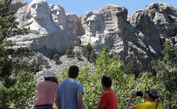 Tourists visit Mount Rushmore National Monument on Wednesday. President Trump is expected to visit the federal monument in South Dakota and give a speech before a fireworks display on Friday. Tourists visit Mount Rushmore National Monument on Wednesday. President Trump is expected to visit the federal monument in South Dakota and give a speech before a fireworks display on Friday.