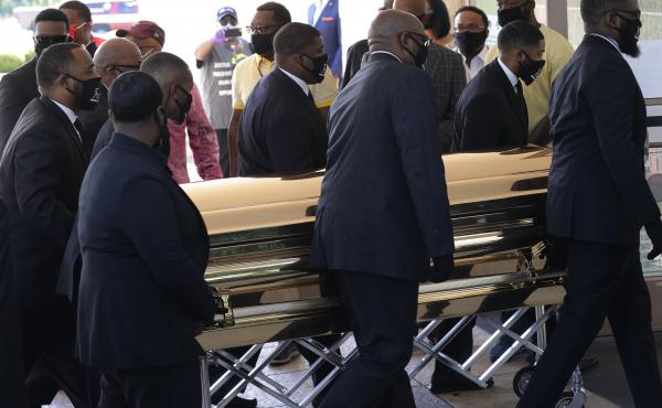 The casket of George Floyd arrives for a public memorial at The Fountain of Praise church in Houston on Monday. The casket of George Floyd arrives for a public memorial at The Fountain of Praise church in Houston on Monday.