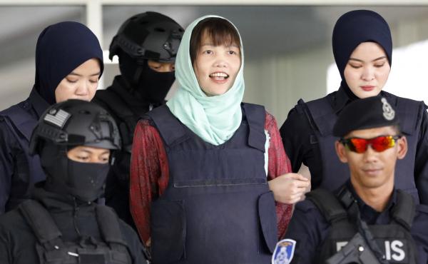 Doan Thi Huong (center) leaves the court in Shah Alam, Malaysia, on Monday. Prosecutors have dropped murder charges against her. Doan Thi Huong (center) leaves the court in Shah Alam, Malaysia, on Monday. Prosecutors have dropped murder charges against her.