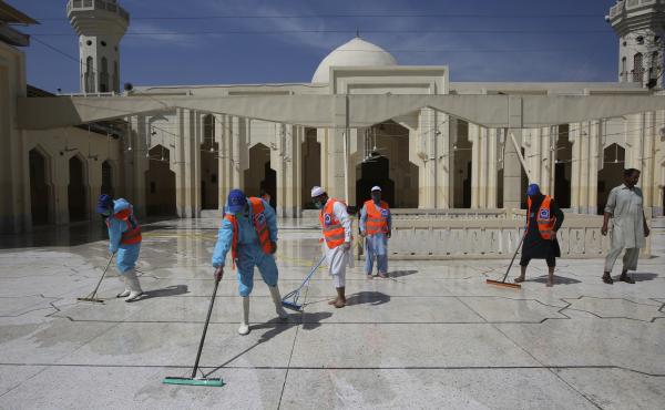 Volunteers disinfect a mosque ahead of prayers during the Muslim holy month of Ramadan in Peshawar, Pakistan, on Friday. Volunteers disinfect a mosque ahead of prayers during the Muslim holy month of Ramadan in Peshawar, Pakistan, on Friday.