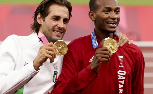 Gold medalists Gianmarco Tamberi of Italy and Mutaz Essa Barshim of Qatar shared the podium after the men's high jump at the Tokyo 2020 Olympic Games at Olympic Stadium. Gold medalists Gianmarco Tamberi of Italy and Mutaz Essa Barshim of Qatar shared the podium after the men's high jump at the Tokyo 2020 Olympic Games at Olympic Stadium.
