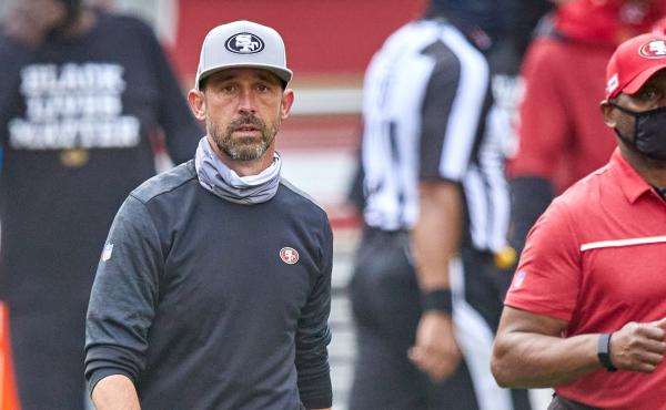 The NFL has fined San Francisco 49ers head coach Kyle Shanahan and two other coaches for not following rules about keeping their faces covered. Here, Shanahan walks off the field after his team's Sept. 13 game against the Arizona Cardinals. The NFL has fined San Francisco 49ers head coach Kyle Shanahan and two other coaches for not following rules about keeping their faces covered. Here, Shanahan walks off the field after his team's Sept. 13 game against the Arizona Cardinals.
