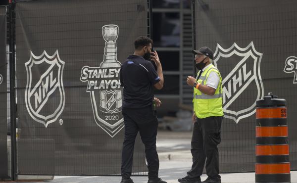 Personnel enter and exit the NHL bubble in Toronto, one of two host cities, along with Edmonton, where the league has resumed its season. Personnel enter and exit the NHL bubble in Toronto, one of two host cities, along with Edmonton, where the league has resumed its season.