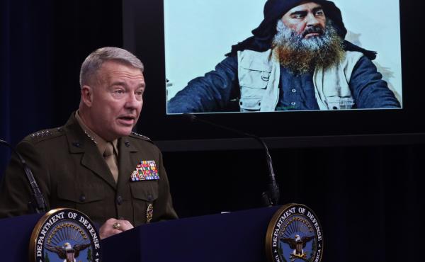 Marine Corps Gen. Kenneth McKenzie, commander of U.S. Central Command, speaks as a picture of Abu Bakr al-Baghdadi is displayed during a news briefing on Oct. 30, 2019, at the Pentagon in Arlington, Virginia. McKenzie spoke to reporters to provide an upda Marine Corps Gen. Kenneth McKenzie, commander of U.S. Central Command, speaks as a picture of Abu Bakr al-Baghdadi is displayed during a news briefing on Oct. 30, 2019, at the Pentagon in Arlington, Virginia. McKenzie spoke to reporters to provide an upda