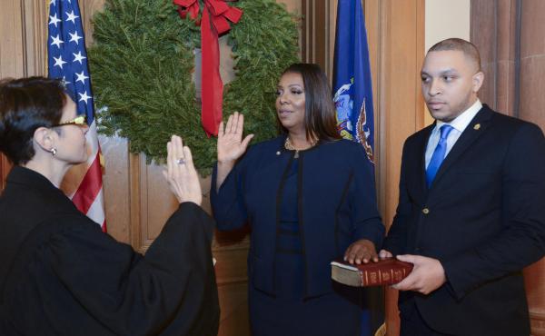Letitia James (center) is sworn in as New York's 67th Attorney General in a ceremony Monday night at the state capitol in Albany. James is the state's first black attorney general, as well as the first woman to hold the state-wide elected office. Letitia James (center) is sworn in as New York's 67th Attorney General in a ceremony Monday night at the state capitol in Albany. James is the state's first black attorney general, as well as the first woman to hold the state-wide elected office.