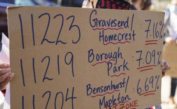 Teachers and staff protest outside Franklin D. Roosevelt High School as they call for more and better COVID-19 testing and precautions on Friday in New York City. The ZIP codes listed on this sign are among those soon to face restrictions by the city. Teachers and staff protest outside Franklin D. Roosevelt High School as they call for more and better COVID-19 testing and precautions on Friday in New York City. The ZIP codes listed on this sign are among those soon to face restrictions by the city.