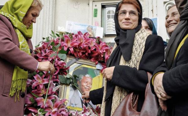 Iranian human rights lawyer Nasrin Sotoudeh with a poster of South Africa's Nelson Mandela, in a scene from the Nasrin documentary. Iranian human rights lawyer Nasrin Sotoudeh with a poster of South Africa's Nelson Mandela, in a scene from the Nasrin documentary.