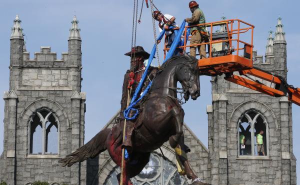 Crews attach straps in July to the statue of Confederate Gen. J.E.B. Stuart in Richmond, Va. The statue was one of several that were removed by the city in 2020 following nationwide protests against systemic racism. Crews attach straps in July to the statue of Confederate Gen. J.E.B. Stuart in Richmond, Va. The statue was one of several that were removed by the city in 2020 following nationwide protests against systemic racism.