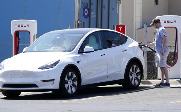 A Tesla owner charges his vehicle in April 2021 at a charging station in Topeka, Kan.. Tesla reported 273 crashes involving partially automated driving systems, according to statistics released by U.S. safety regulators on Wednesday. A Tesla owner charges his vehicle in April 2021 at a charging station in Topeka, Kan.. Tesla reported 273 crashes involving partially automated driving systems, according to statistics released by U.S. safety regulators on Wednesday.