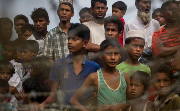 Rohingya refugees gather in the "no man's land" behind Myanmar's barbed-wire-lined border in Maungdaw district, Rakhine state, in 2018. Some 700,000 refugees fled into Bangladesh following a brutal crackdown by the Myanmar military in 2017. Rohingya refugees gather in the "no man's land" behind Myanmar's barbed-wire-lined border in Maungdaw district, Rakhine state, in 2018. Some 700,000 refugees fled into Bangladesh following a brutal crackdown by the Myanmar military in 2017.