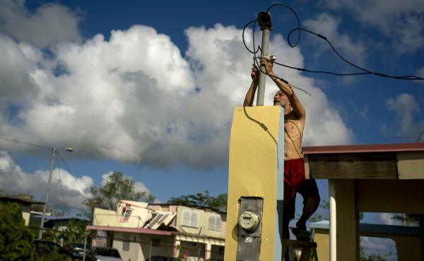 In October 2017, a resident tries to connect electrical lines downed by Hurricane Maria in Toa Baja. Puerto Rican officials say electricity has returned to all residents without it after the hurricane. In October 2017, a resident tries to connect electrical lines downed by Hurricane Maria in Toa Baja. Puerto Rican officials say electricity has returned to all residents without it after the hurricane.