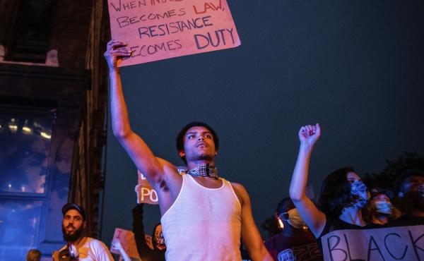 Tyreece Johnson, of Omaha, Neb., and dozens of other people march from the Omaha Douglas Civic Center to the Old Market in Omaha on Wednesday. James Scurlock, a 22-year-old black man, was shot and killed in the Old Market on Saturday night by a white bar Tyreece Johnson, of Omaha, Neb., and dozens of other people march from the Omaha Douglas Civic Center to the Old Market in Omaha on Wednesday. James Scurlock, a 22-year-old black man, was shot and killed in the Old Market on Saturday night by a white bar