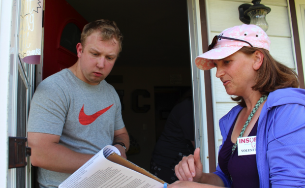 Nebraska resident Nick Carpenter listens as Becky Gould explains the Medicaid expansion petition in early July. Nebraska resident Nick Carpenter listens as Becky Gould explains the Medicaid expansion petition in early July.