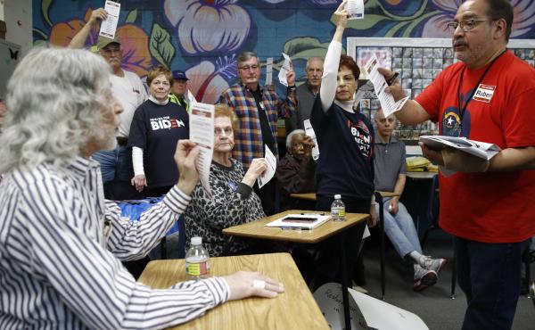 A precinct leader, right, counts votes at a caucus location at Coronado High School in Henderson, Nev., on Saturday. A precinct leader, right, counts votes at a caucus location at Coronado High School in Henderson, Nev., on Saturday.