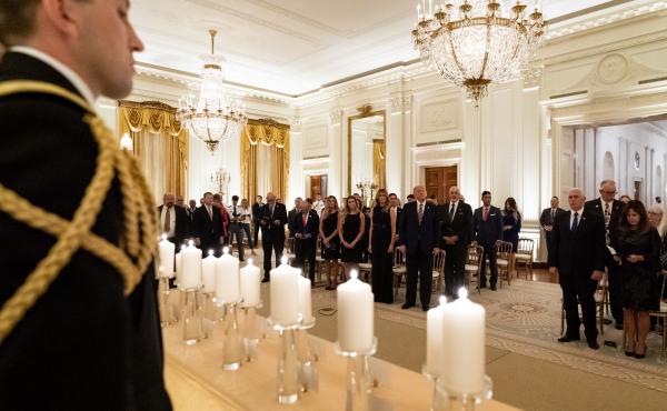 President Donald Trump and First Lady Melania Trump join guests in singing "America the Beautiful" during a reception in honor of Gold Star Families on Sept. 27, in the East Room of the White House. President Donald Trump and First Lady Melania Trump join guests in singing "America the Beautiful" during a reception in honor of Gold Star Families on Sept. 27, in the East Room of the White House.