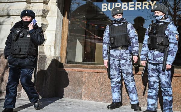 A Russian police officer and national guard servicemen patrol Red Square next to Burberry shop in Moscow on Thursday. The U.K. imposed a new export ban that will likely affect luxury vehicles, high-end fashion and works of art. A Russian police officer and national guard servicemen patrol Red Square next to Burberry shop in Moscow on Thursday. The U.K. imposed a new export ban that will likely affect luxury vehicles, high-end fashion and works of art.