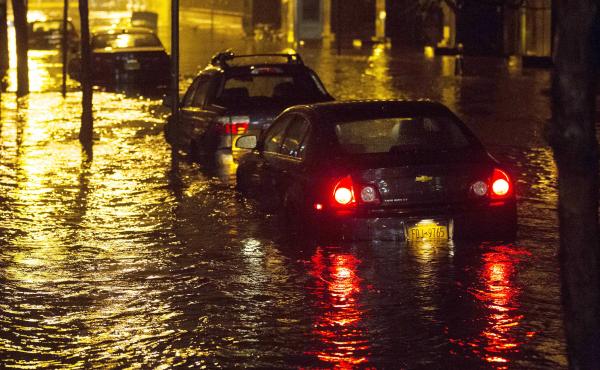 Vehicles sit in high floodwater during a storm surge associated with Superstorm Sandy in 2012, near the Brooklyn Battery Tunnel in New York. Vehicles sit in high floodwater during a storm surge associated with Superstorm Sandy in 2012, near the Brooklyn Battery Tunnel in New York.