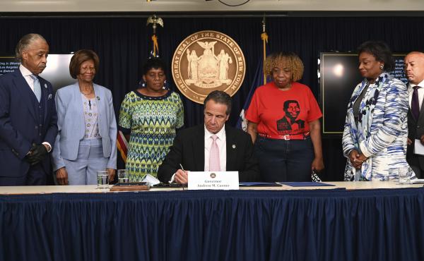 On June 12, New York Governor Andrew Cuomo (center) signs into law a package of police accountability measures that received new backing after the killing of George Floyd. On June 12, New York Governor Andrew Cuomo (center) signs into law a package of police accountability measures that received new backing after the killing of George Floyd.