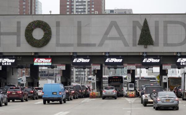 Holiday decorations adorn the letters on the toll booths at the Holland Tunnel last week in Jersey City. Holiday decorations adorn the letters on the toll booths at the Holland Tunnel last week in Jersey City.