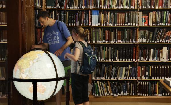 Visitors look at a globe in the map division at the main branch of the New York Public Library in New York. The library announced an effort this week to make commonly banned books available through their app. Visitors look at a globe in the map division at the main branch of the New York Public Library in New York. The library announced an effort this week to make commonly banned books available through their app.