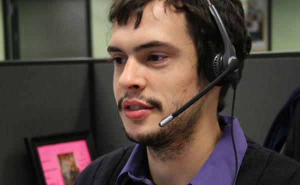 Joey Cappuccitti, who works at a Maximus call center, talks with a person looking for help with New York's insurance exchange. Joey Cappuccitti, who works at a Maximus call center, talks with a person looking for help with New York's insurance exchange.