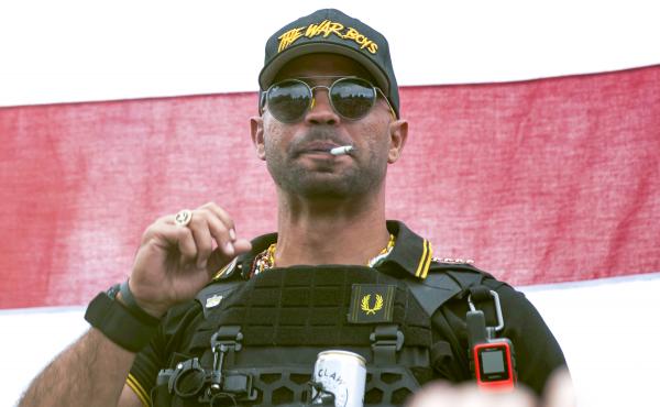Proud Boys leader Henry "Enrique" Tarrio wears a hat that says The War Boys during a rally in Portland, Ore., Sept. 26, 2020. Tarrio, the former top leader of the Proud Boys, will remain jailed while awaiting trial on charges that he conspired with other Proud Boys leader Henry "Enrique" Tarrio wears a hat that says The War Boys during a rally in Portland, Ore., Sept. 26, 2020. Tarrio, the former top leader of the Proud Boys, will remain jailed while awaiting trial on charges that he conspired with other