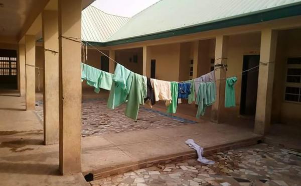 School uniforms hang in the deserted dormitory of the Government Girls Science Secondary School at Jangede, Zamfara State in northwest Nigeria, where more than 300 students were kidnapped by gunmen early Friday, local time. School uniforms hang in the deserted dormitory of the Government Girls Science Secondary School at Jangede, Zamfara State in northwest Nigeria, where more than 300 students were kidnapped by gunmen early Friday, local time.