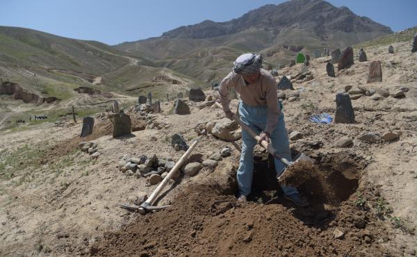 A gravedigger in Kabul. A gravedigger in Kabul.