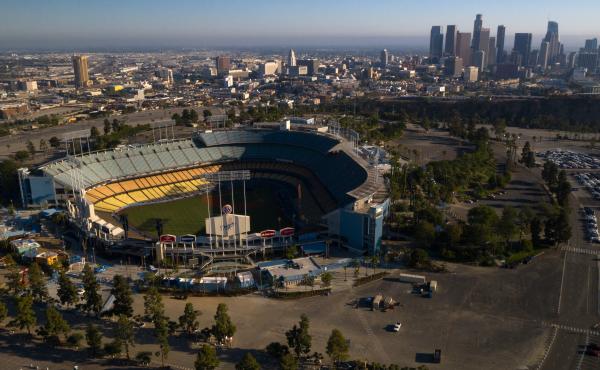 Dodger Stadium in Los Angeles stands empty in an aerial view from late May. Games will resume in late July. Dodger Stadium in Los Angeles stands empty in an aerial view from late May. Games will resume in late July.