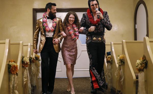 Elvis impersonator Brendan Paul (right) walks down the aisle during a wedding ceremony for Katie Salvatore and Eric Wheeler at the Graceland Wedding Chapel in Las Vegas. Elvis impersonator Brendan Paul (right) walks down the aisle during a wedding ceremony for Katie Salvatore and Eric Wheeler at the Graceland Wedding Chapel in Las Vegas.