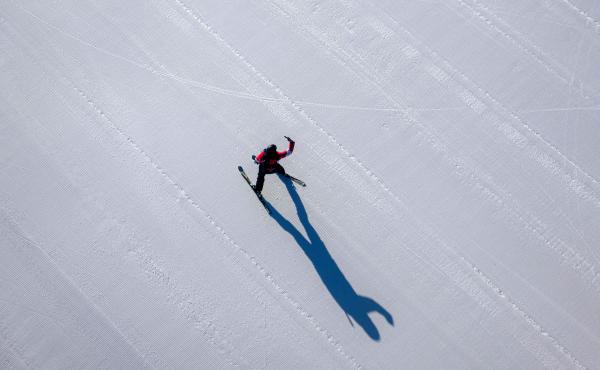 A skier takes a selfie on a course covered with artificial snow at the Yanqing National Alpine Skiing Centre in Yanqing. A skier takes a selfie on a course covered with artificial snow at the Yanqing National Alpine Skiing Centre in Yanqing.
