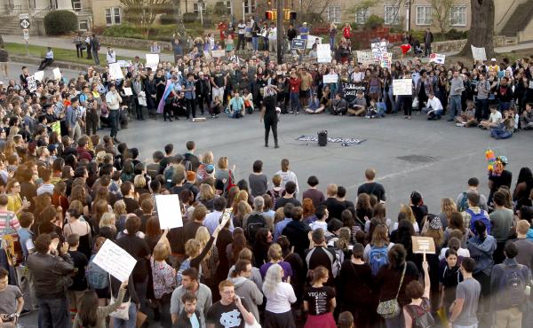 Hundreds attend a rally in Chapel Hill, N.C., on March 29 to protest the passage of House Bill 2. The state of North Carolina and the U.S. Justice Department are suing each other over the law's restriction on protections for lesbian, gay, bisexual and tra Hundreds attend a rally in Chapel Hill, N.C., on March 29 to protest the passage of House Bill 2. The state of North Carolina and the U.S. Justice Department are suing each other over the law's restriction on protections for lesbian, gay, bisexual and tra