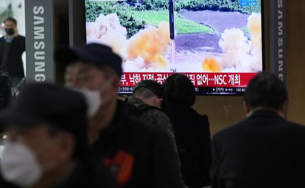 People watch a TV showing a file image of North Korea's missile launch during a news program at the Seoul Railway Station in Seoul, South Korea, on Thursday. People watch a TV showing a file image of North Korea's missile launch during a news program at the Seoul Railway Station in Seoul, South Korea, on Thursday.