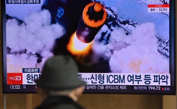 People watch a television screen showing a news broadcast with file footage of a North Korean missile test, at a railway station in Seoul on Wednesday, after North Korea fired an "unidentified projectile." People watch a television screen showing a news broadcast with file footage of a North Korean missile test, at a railway station in Seoul on Wednesday, after North Korea fired an "unidentified projectile."