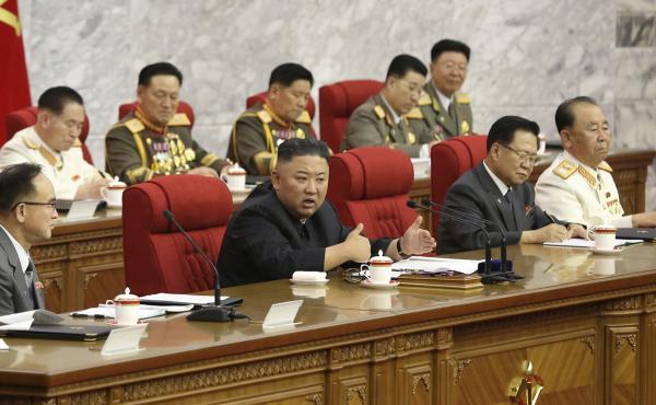 In this photo provided by the North Korean government, North Korean leader Kim Jong Un, center, speaks during a Workers' Party meeting Thursday in Pyongyang. Kim ordered his government to be fully prepared for confrontation with the Biden administration, In this photo provided by the North Korean government, North Korean leader Kim Jong Un, center, speaks during a Workers' Party meeting Thursday in Pyongyang. Kim ordered his government to be fully prepared for confrontation with the Biden administration,